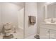 Well lit bathroom featuring tiled floors, a vanity, toilet, and shower with curtain at 3125 Leonard Dr, Gastonia, NC 28056
