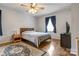 Cozy bedroom with hardwood floors, ceiling fan, and natural light from the window at 3125 Leonard Dr, Gastonia, NC 28056