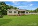 Charming single-story home with a well-manicured lawn and inviting front porch at 3125 Leonard Dr, Gastonia, NC 28056