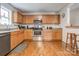 Efficient kitchen with wooden cabinetry and stainless steel appliances at 3125 Leonard Dr, Gastonia, NC 28056