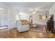 Open concept living space with hardwood floors and a view of the kitchen at 3125 Leonard Dr, Gastonia, NC 28056