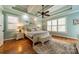Serene bedroom with tray ceiling, plantation shutters, and plush rug at 3500 Maple Wood Dr, Denver, NC 28037