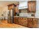 Modern kitchen with stainless steel refrigerator and plentiful cabinets and countertops at 3500 Maple Wood Dr, Denver, NC 28037