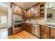 Gourmet kitchen featuring stainless appliances, ample cabinetry, and an adjacent breakfast nook at 3500 Maple Wood Dr, Denver, NC 28037