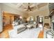 Spacious living room features a coffered ceiling, fireplace, and open access to the kitchen and dining area at 3500 Maple Wood Dr, Denver, NC 28037