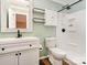Charming bathroom with a tub and shower combo, white vanity, and rustic mirror at 3572 Heather Ln, Gastonia, NC 28056