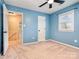 Blue bedroom with a window, ceiling fan, and carpeted floor at 3572 Heather Ln, Gastonia, NC 28056