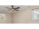 Bright and airy bedroom featuring two windows and a ceiling fan for added comfort at 3572 Heather Ln, Gastonia, NC 28056