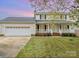 Charming two-story home featuring a covered front porch and attached two-car garage at 3572 Heather Ln, Gastonia, NC 28056