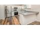 Modern kitchen features stainless steel appliances, granite countertops, and ample cabinet space at 3572 Heather Ln, Gastonia, NC 28056