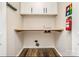 Functional laundry room with built-in shelf space at 3572 Heather Ln, Gastonia, NC 28056