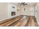 A bright living room boasts a fireplace and durable flooring, perfect for entertaining at 3572 Heather Ln, Gastonia, NC 28056