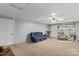 Finished basement featuring carpet floors, a large sofa, and recreational space at 402 Swaim Ct, Salisbury, NC 28147