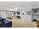Spacious basement features plush seating, a television, and built in shelves at 402 Swaim Ct, Salisbury, NC 28147