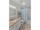 Updated bathroom featuring a shower, tub and a single vanity with modern fixtures at 402 Swaim Ct, Salisbury, NC 28147