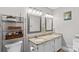 Well-lit bathroom with dual sinks, granite countertops, and decorative framed mirrors at 402 Swaim Ct, Salisbury, NC 28147