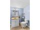 Powder blue bathroom featuring a white vanity and toilet, and a light brown tile floor at 402 Swaim Ct, Salisbury, NC 28147