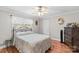 Cozy bedroom featuring a metal bed frame and hardwood floors at 402 Swaim Ct, Salisbury, NC 28147
