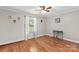 Bright bedroom with hardwood floors, a window with sheer curtains, and neutral wall paint at 402 Swaim Ct, Salisbury, NC 28147