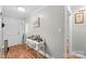 Inviting entryway with hardwood floors, a white door, a decorative table, and elegant trim work at 402 Swaim Ct, Salisbury, NC 28147