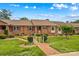 Inviting brick home with a well-manicured lawn, walkway, and neatly trimmed bushes for enhanced curb appeal at 402 Swaim Ct, Salisbury, NC 28147
