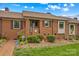 Well-maintained brick home with manicured bushes, a lovely garden, and an inviting entryway for a cozy feel at 402 Swaim Ct, Salisbury, NC 28147