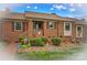 Charming brick home featuring well-maintained landscaping, a welcoming front entrance, and lovely curb appeal at 402 Swaim Ct, Salisbury, NC 28147