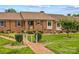 Charming brick home featuring manicured landscaping, a welcoming entrance, and an inviting front yard pathway at 402 Swaim Ct, Salisbury, NC 28147