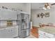Kitchen area featuring stainless steel refrigerator, granite countertop and white cabinets at 402 Swaim Ct, Salisbury, NC 28147