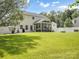 Spacious backyard with green lawn and fenced-in patio area at 4113 Edgeview Dr, Indian Trail, NC 28079