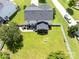 Aerial view of a large backyard with green grass, white fence, patio, and screened-in porch at 4113 Edgeview Dr, Indian Trail, NC 28079