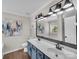 Bathroom featuring double sink vanity, modern lighting, and large mirror at 4113 Edgeview Dr, Indian Trail, NC 28079