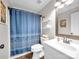 Well-lit bathroom with a shower, vanity, and decorative accents, creating a cozy atmosphere at 4113 Edgeview Dr, Indian Trail, NC 28079