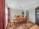 Formal dining room with hardwood floors, area rug, and large window overlooking the yard at 4113 Edgeview Dr, Indian Trail, NC 28079