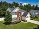 Aerial view of a two-story home with well-manicured lawn and mature landscaping at 4113 Edgeview Dr, Indian Trail, NC 28079