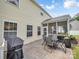 Outdoor patio with table, chairs, and grill for outdoor dining and entertaining at 4113 Edgeview Dr, Indian Trail, NC 28079