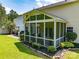 Inviting screened porch with stylish decor and a well-maintained landscape enhances outdoor living at 4113 Edgeview Dr, Indian Trail, NC 28079