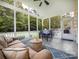 Relaxing screened-in porch with comfortable seating and a dining area at 4113 Edgeview Dr, Indian Trail, NC 28079