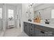 Modern bathroom with double vanity, gray cabinets, quartz countertop, and sleek finishes, creating a luxurious space at 433 Sinaloa St, Waxhaw, NC 28173