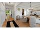 Elegant dining room featuring stylish lighting, wainscoting, and hardwood flooring at 433 Sinaloa St, Waxhaw, NC 28173