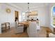 Bright dining room showcasing a stylish chandelier, hardwood floors, and elegant decor at 433 Sinaloa St, Waxhaw, NC 28173