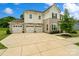 Beautiful home with a stone facade, three-car garage, and a large driveway perfect for Gathering living at 433 Sinaloa St, Waxhaw, NC 28173