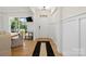 Bright foyer featuring hardwood floors, white wainscoting, and elegant decor at 433 Sinaloa St, Waxhaw, NC 28173