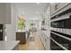Bright, open kitchen with stainless steel appliances, subway tile backsplash and hardwood flooring at 433 Sinaloa St, Waxhaw, NC 28173