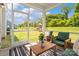 Relaxing screened-in patio with outdoor furniture, perfect for enjoying the backyard views at 433 Sinaloa St, Waxhaw, NC 28173