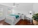 Bright bedroom features hardwood floors, white trim, and a classic vanity with a stool at 4500 Carrington Dr, Lancaster, SC 29720