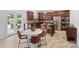 Lovely kitchen with cherry cabinets, stainless steel appliances, and a cozy breakfast nook at 4500 Carrington Dr, Lancaster, SC 29720