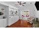 Bright and airy living room with built-in shelves and access to a relaxing sunroom at 4500 Carrington Dr, Lancaster, SC 29720