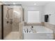 Modern bathroom with a glass shower and a soaking tub at 4500 Carrington Dr, Lancaster, SC 29720