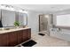 Luxurious main bathroom featuring dual vanities, a glass shower, and a soaking tub at 4500 Carrington Dr, Lancaster, SC 29720